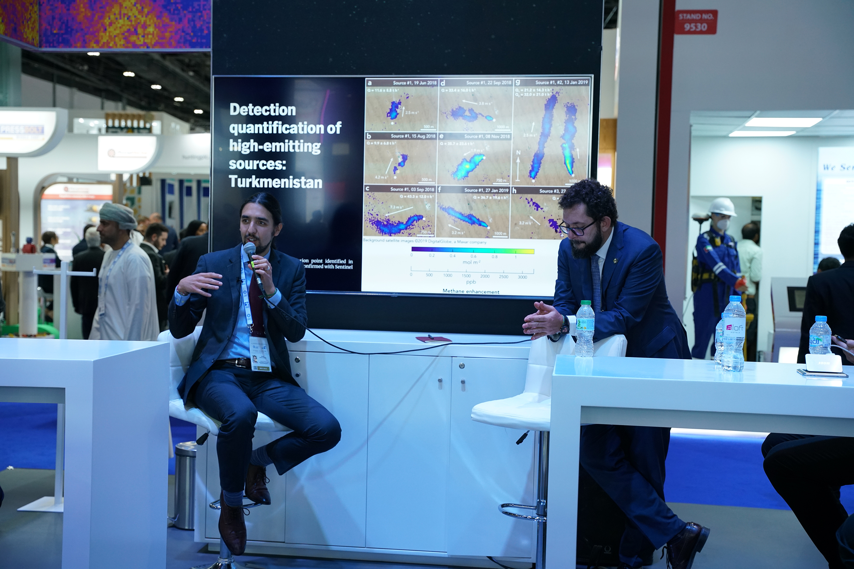 Daniel Zavala-Araiza, with a microphone, speaking at a conference.