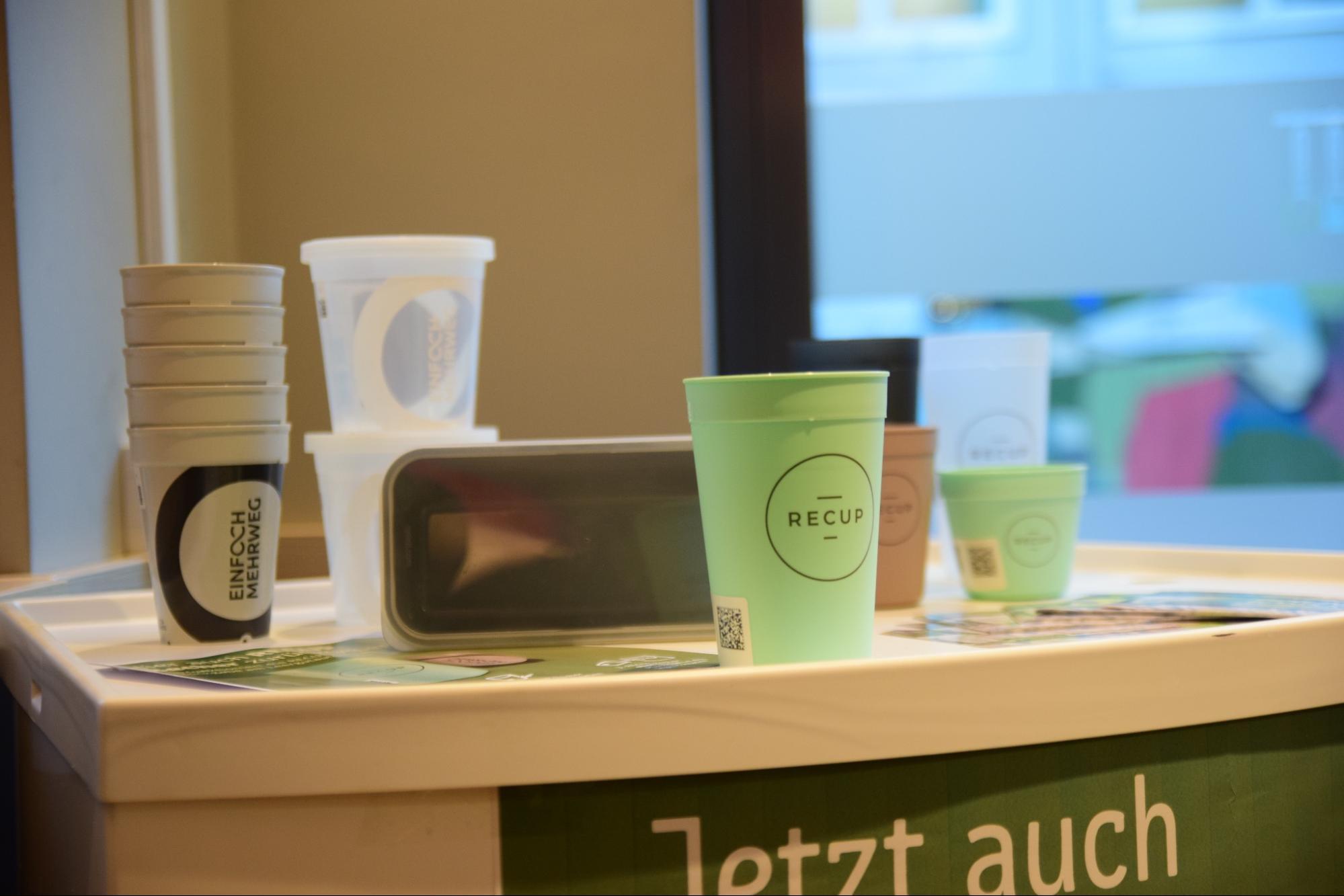 Reusable cups in a bright room.